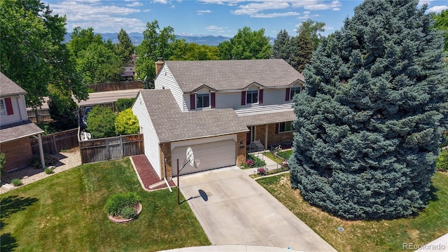 7865 S Lafayette Ct, Centennial, CO 80122 - traditional-style house featuring roof with shingles, concrete driveway, a garage, and brick siding