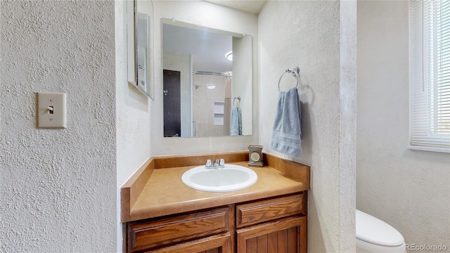 7865 S Lafayette Ct, Centennial, CO 80122 - full bathroom featuring a textured wall, vanity, and a shower