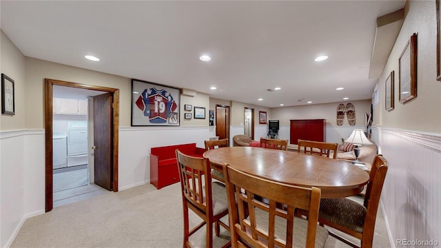 7865 S Lafayette Ct, Centennial, CO 80122 - dining room with light carpet, a wainscoted wall, washer / clothes dryer, and recessed lighting