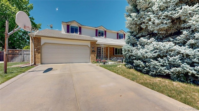 7865 S Lafayette Ct, Centennial, CO 80122 - traditional home with brick siding, driveway, an attached garage, and covered porch