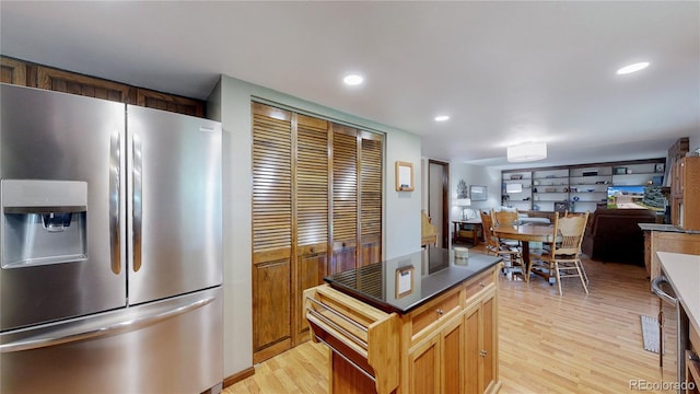 7865 S Lafayette Ct, Centennial, CO 80122 - kitchen with stainless steel refrigerator with ice dispenser, light wood-style flooring, dark countertops, recessed lighting, and a center island