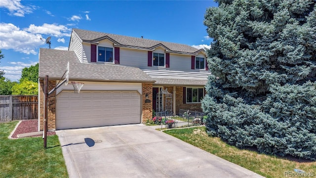 7865 S Lafayette Ct, Centennial, CO 80122 - traditional home featuring brick siding, an attached garage, driveway, and a shingled roof