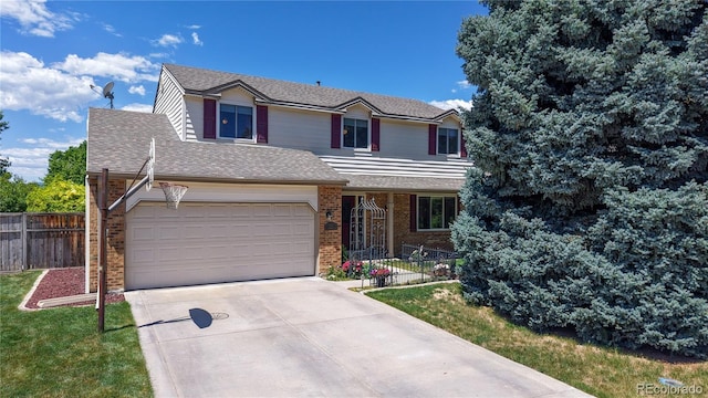 7865 S Lafayette Ct, Centennial, CO 80122 - traditional home featuring brick siding, driveway, and a shingled roof