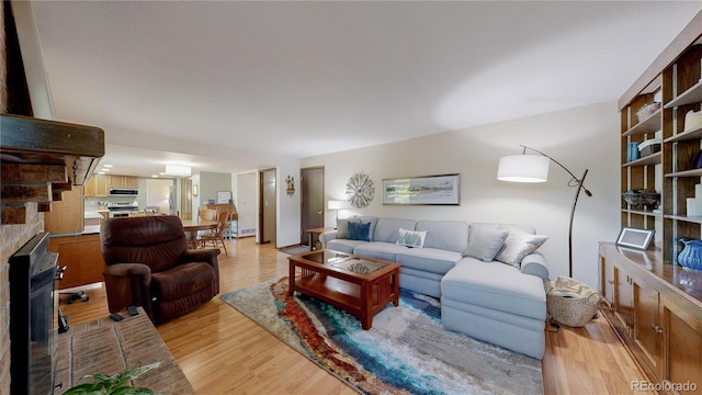 7865 S Lafayette Ct, Centennial, CO 80122 - living area featuring light wood-style flooring and a fireplace