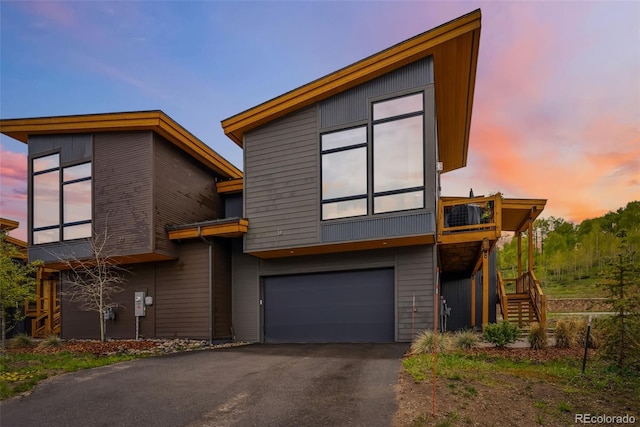 14 E Baron Way, Silverthorne, CO 80498 - contemporary home with stairs, a garage, and asphalt driveway