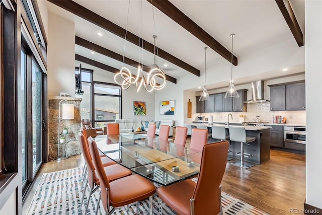 14 E Baron Way, Silverthorne, CO 80498 - dining area featuring light wood-style floors, beamed ceiling, a chandelier, and recessed lighting