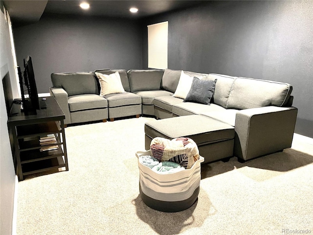 living room featuring recessed lighting and carpet