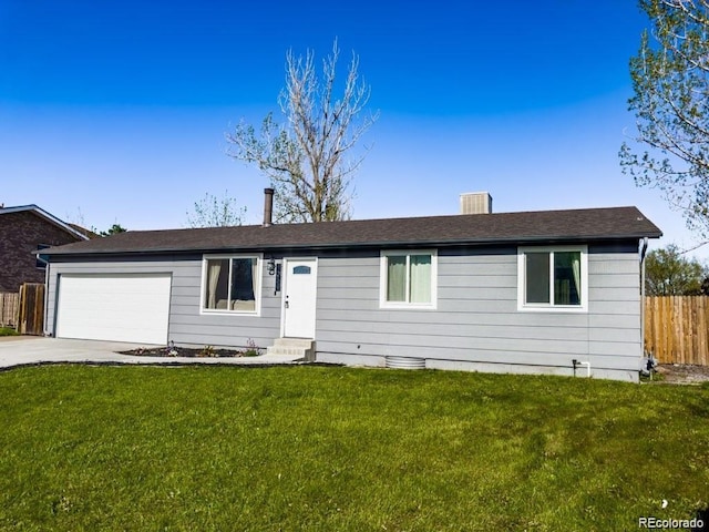 ranch-style home with a garage and a front yard