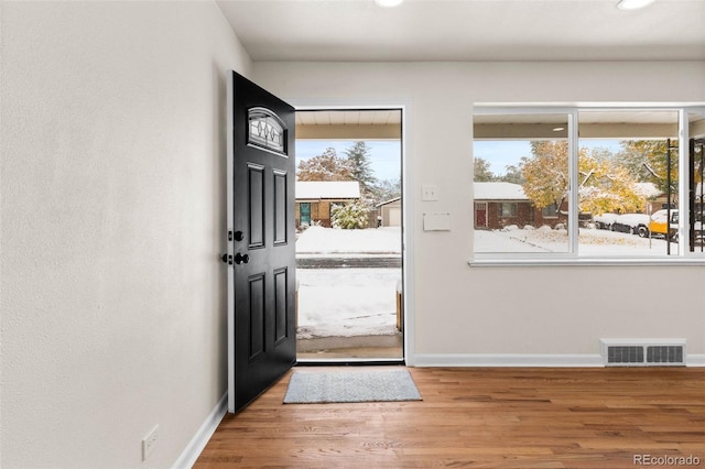 7555 E 22nd Ave, Denver, CO 80207 - foyer entrance featuring baseboards, wood finished floors, and recessed lighting