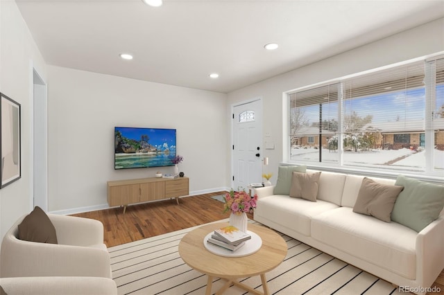 7555 E 22nd Ave, Denver, CO 80207 - living area with light wood-style flooring, baseboards, and recessed lighting