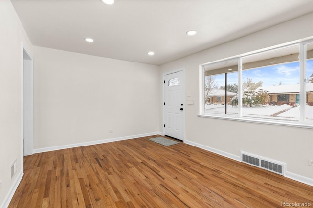 7555 E 22nd Ave, Denver, CO 80207 - foyer featuring wood finished floors, baseboards, and recessed lighting