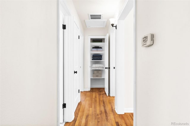 7555 E 22nd Ave, Denver, CO 80207 - corridor featuring light wood-style flooring