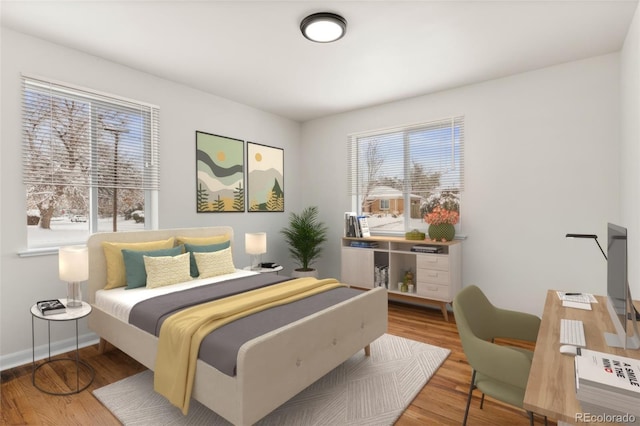 7555 E 22nd Ave, Denver, CO 80207 - bedroom featuring wood finished floors and baseboards