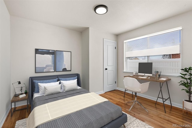 7555 E 22nd Ave, Denver, CO 80207 - bedroom with wood finished floors and baseboards