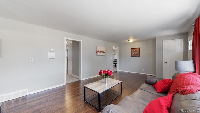 living room featuring dark hardwood / wood-style floors