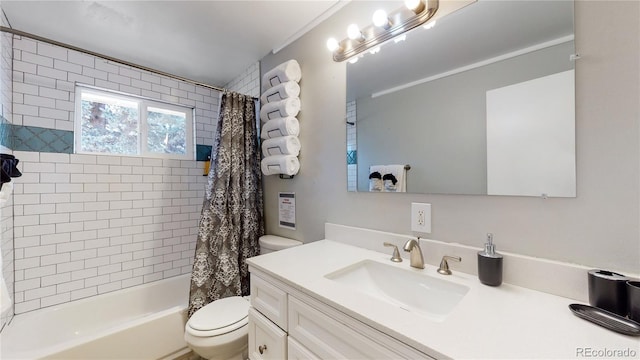 full bathroom featuring vanity, toilet, and shower / tub combo