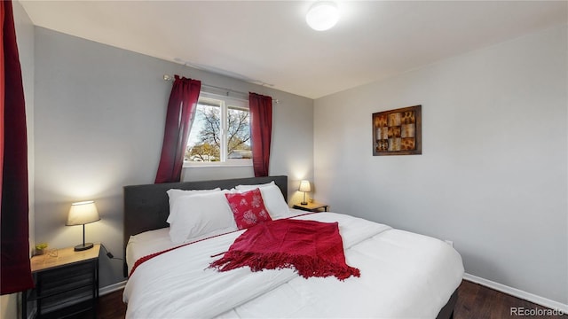 bedroom featuring dark hardwood / wood-style floors