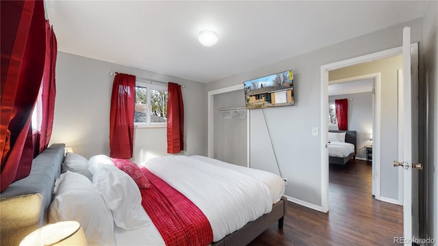 bedroom with a closet and dark hardwood / wood-style floors