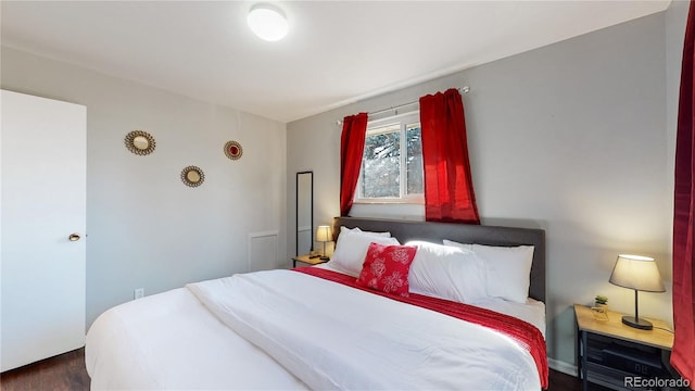 bedroom featuring dark hardwood / wood-style floors