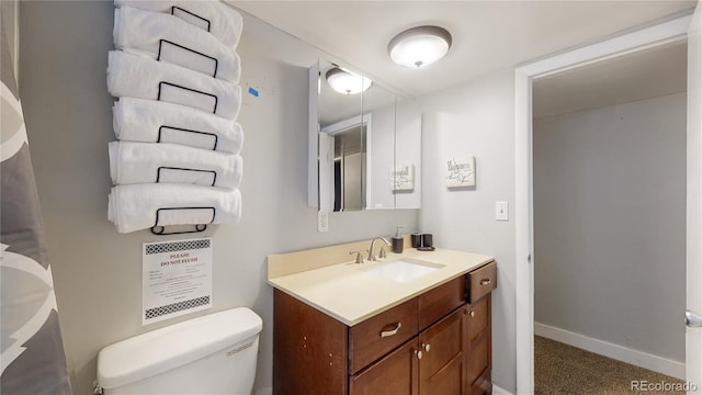 bathroom featuring vanity and toilet