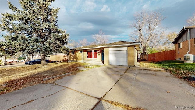 ranch-style house featuring a garage