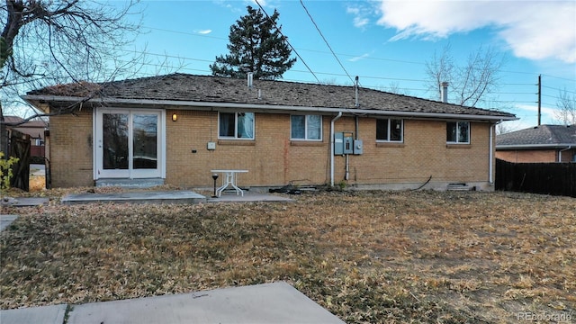 back of house with a yard and a patio area