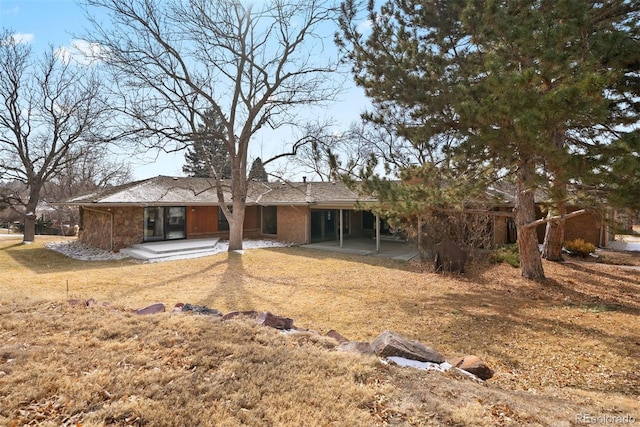 rear view of house with a patio