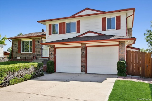 1791 S Laredo St, Aurora, CO 80017 - view of front of house with concrete driveway, brick siding, and an attached garage