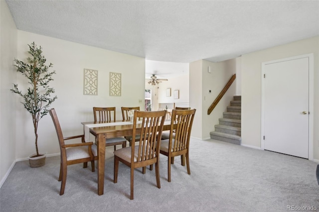 1791 S Laredo St, Aurora, CO 80017 - dining room with light carpet, stairway, a ceiling fan, and a textured ceiling