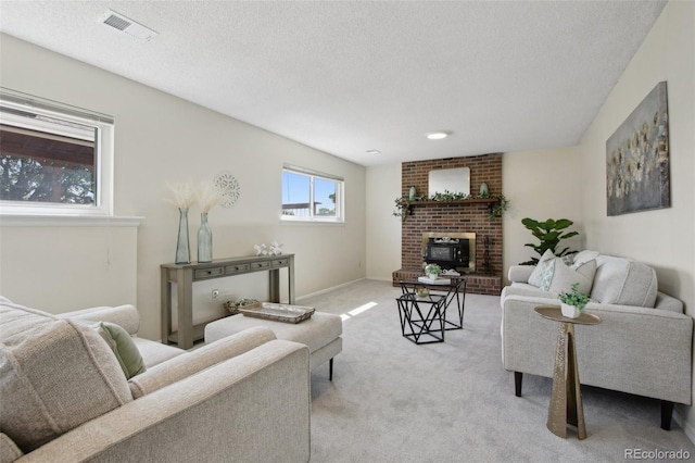1791 S Laredo St, Aurora, CO 80017 - living area featuring a fireplace, light carpet, and a textured ceiling