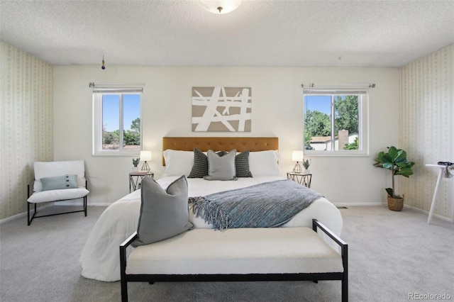 1791 S Laredo St, Aurora, CO 80017 - bedroom featuring wallpapered walls, a textured ceiling, and carpet flooring