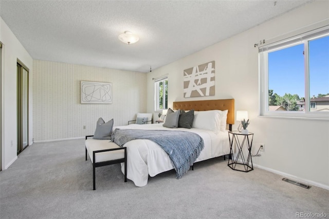 1791 S Laredo St, Aurora, CO 80017 - carpeted bedroom featuring baseboards and a textured ceiling
