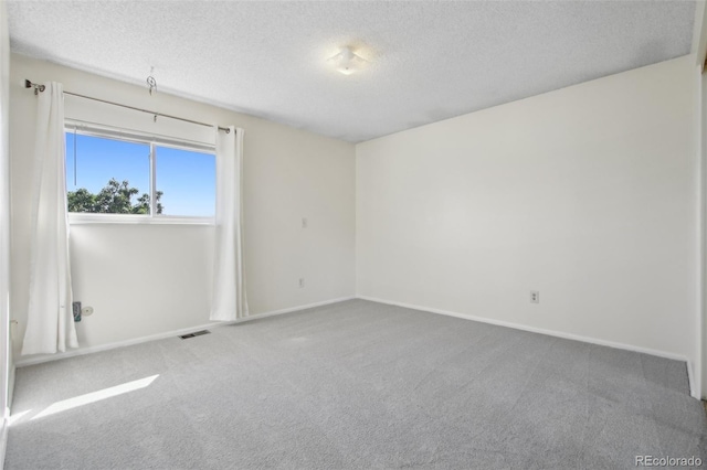 1791 S Laredo St, Aurora, CO 80017 - spare room featuring carpet flooring and a textured ceiling