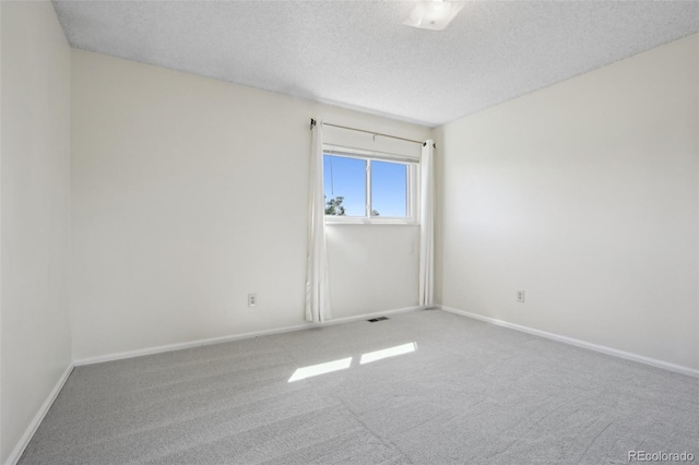 1791 S Laredo St, Aurora, CO 80017 - carpeted empty room featuring a textured ceiling and baseboards