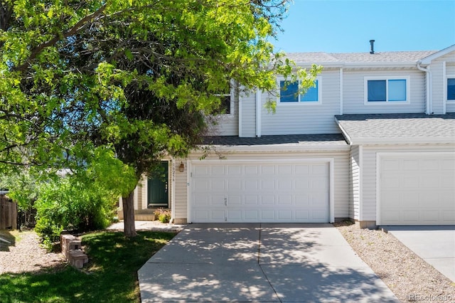 16256 E Otero Pl, Englewood, CO 80112 - multi unit property with driveway, roof with shingles, and a garage