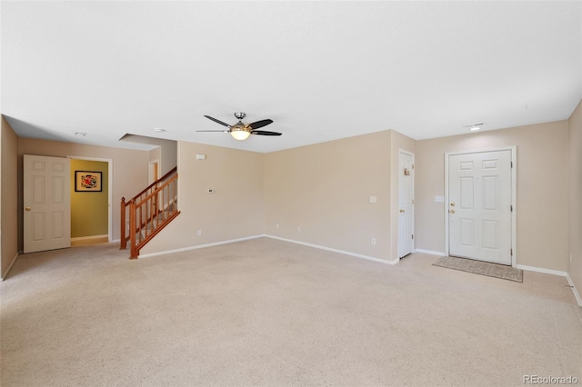 16256 E Otero Pl, Englewood, CO 80112 - unfurnished living room featuring a ceiling fan, light colored carpet, and baseboards