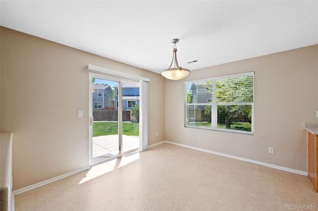 16256 E Otero Pl, Englewood, CO 80112 - empty room featuring plenty of natural light and baseboards
