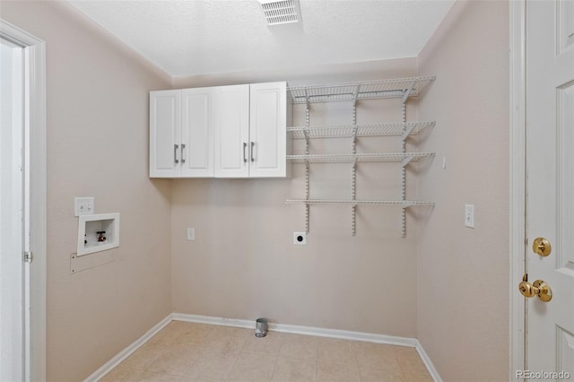16256 E Otero Pl, Englewood, CO 80112 - laundry room featuring washer hookup, baseboards, hookup for an electric dryer, and cabinet space