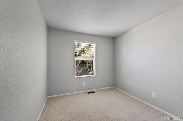 16256 E Otero Pl, Englewood, CO 80112 - carpeted spare room with baseboards and a textured wall