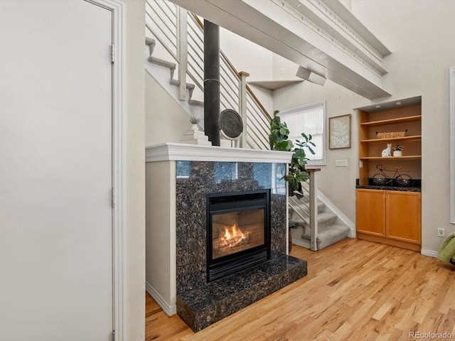 225 N Lincoln St Unit 4, Denver, CO 80203 - detailed view of wood finished floors and a high end fireplace