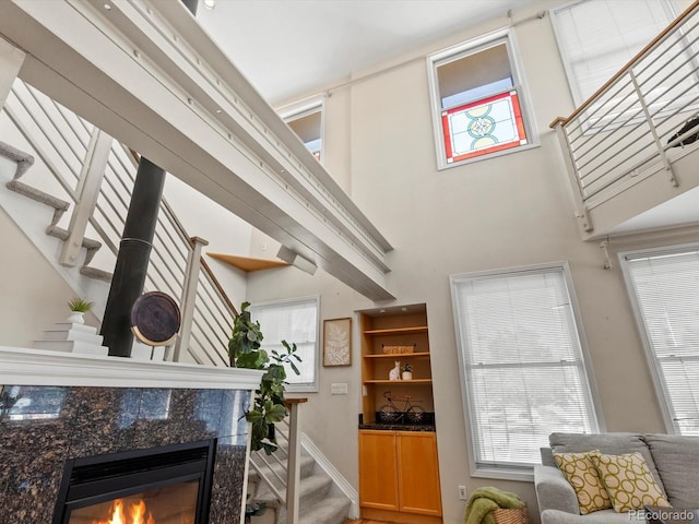 225 N Lincoln St Unit 4, Denver, CO 80203 - living room with stairway, a high end fireplace, and a high ceiling