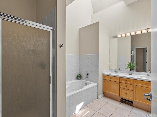225 N Lincoln St Unit 4, Denver, CO 80203 - bathroom with tile patterned floors, a stall shower, double vanity, and a jetted tub