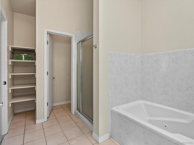 225 N Lincoln St Unit 4, Denver, CO 80203 - bathroom featuring a whirlpool tub, tile patterned floors, and a stall shower