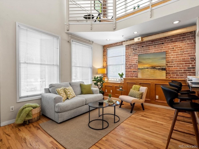 225 N Lincoln St Unit 4, Denver, CO 80203 - living room with wood finished floors and a towering ceiling