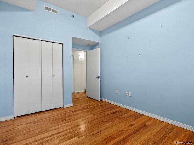 225 N Lincoln St Unit 4, Denver, CO 80203 - unfurnished bedroom featuring a closet and light wood-style floors