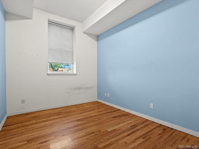 225 N Lincoln St Unit 4, Denver, CO 80203 - unfurnished room featuring baseboards and wood finished floors