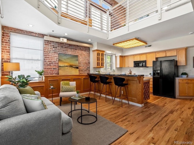 225 N Lincoln St Unit 4, Denver, CO 80203 - living room with light wood-style floors and a high ceiling