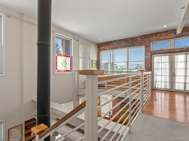 225 N Lincoln St Unit 4, Denver, CO 80203 - hall featuring brick wall and recessed lighting
