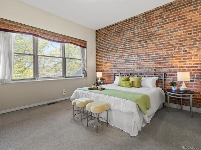 225 N Lincoln St Unit 4, Denver, CO 80203 - bedroom with brick wall and carpet