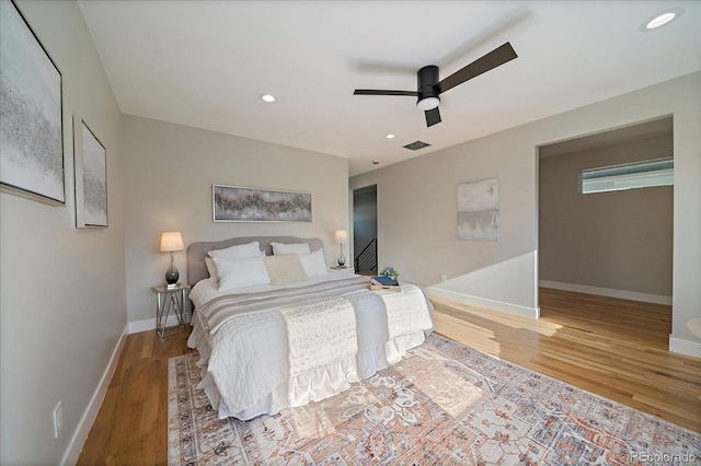 5838 S Louthan St, Littleton, CO 80120 - bedroom featuring wood finished floors, ceiling fan, and recessed lighting